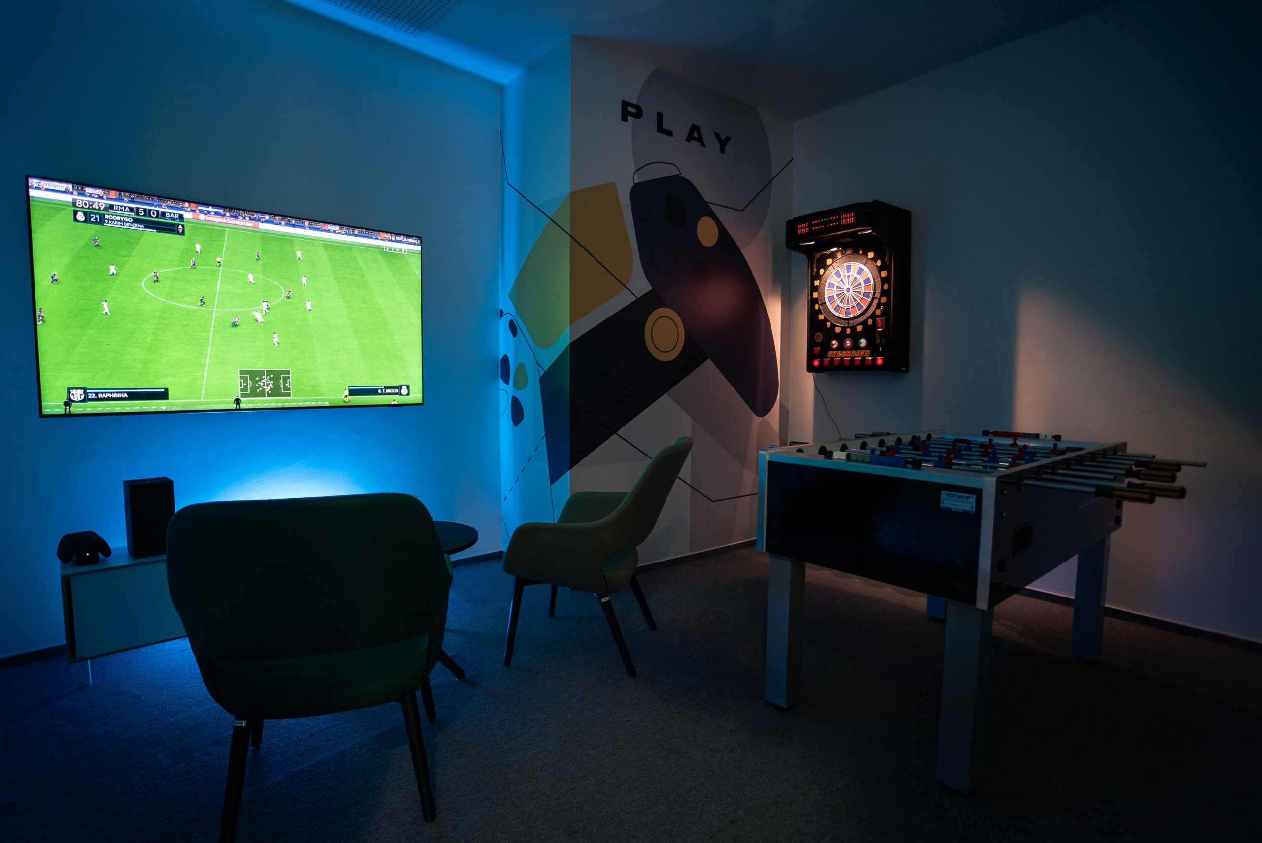 relaxation room with table football and dartboard